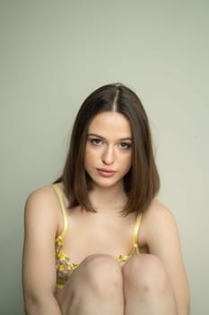 portrait of a young beautiful woman with short hair in the studio