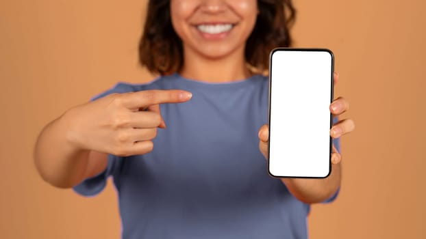 Cropped of middle eastern woman pointing at smartphone
