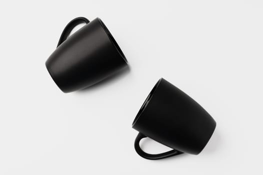 Black coffee mugs mock up on white background copy space