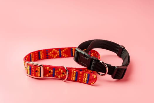 Textile pet collar on pink background studio photo