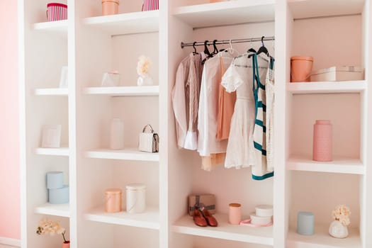 Close-up of organized wardrobe with clothes and accessories