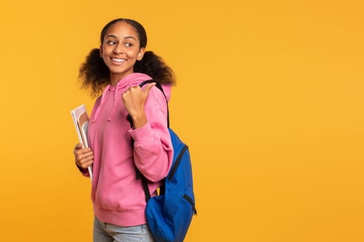 Happy African Student Girl Posing With Backpack And Notebooks, Studio