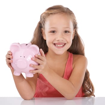 Piggy bank, save money and girl child in portrait, finance and learning cash management on white background. Budget, growth and investment, young person and financial security for future in studio