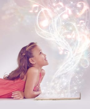 Child, book and magic fantasy or light for storytelling creativity inspiration, surreal or imagination. Female person, kid and whimsical or white background in studio mystic, music or mockup