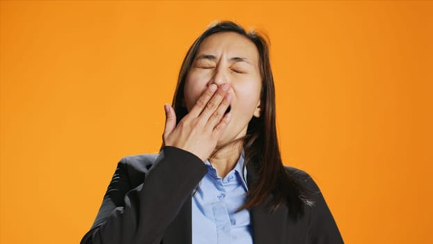 Exhausted person in formal clothes yawning