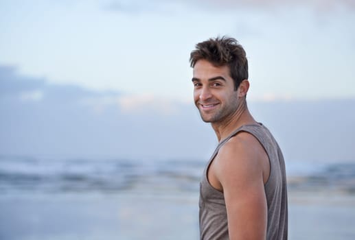 Portrait, smile and beach with man, vacation and happiness with journey and getaway trip. Face, person and guy with holiday, Brazil and adventure with peace and travel with wellness, summer and ocean