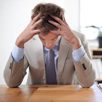 Businessman, stress and overwhelmed in office, mental health and bankrupt or financial crisis. Male person, professional and frustrated in workplace, deadline and depression or mistake and fail
