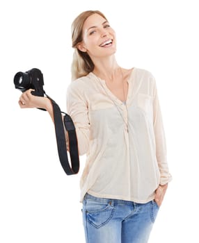 Portrait, photographer and smile of woman with camera in studio isolated on a white background. Confident person, creative paparazzi and technology for hobby, taking pictures or professional shoot