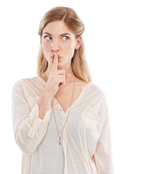 Woman, finger to lips for secret and gossip in studio, private and confidential information on white background. News, announcement and whisper, quiet gesture or emoji for privacy with noise or voice