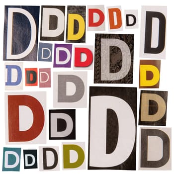 Letter D cut out from newspapers, isolated on white background.