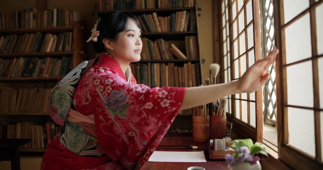 Open window, Japanese and woman with architecture, apartment and morning with culture. Library, calm and zen with sliding door, female person and traditional dress with accommodation in Tokyo