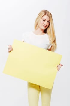 Woman, portrait and placard or mockup space in studio or poster deal for recommendation, communication or white background. Female person, face and blank paper for news bulletin, message or billboard.