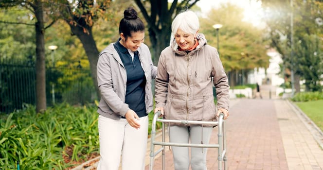 Senior woman, walker and nurse outdoor in a park with healthcare for elderly exercise. Walking, healthcare professional and female person with peace and physical therapy in a public garden with carer