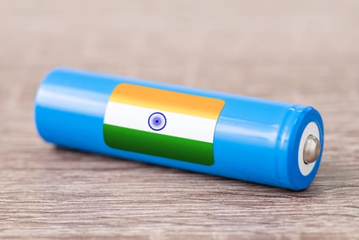 Rechargeable battery with flag of India on table
