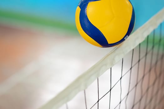 Close up of a ball over the net on volleyball court