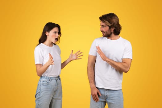 Animated conversation with a woman gesturing in surprise while talking and a man