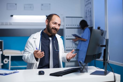 Man wearing lab coat on a video call