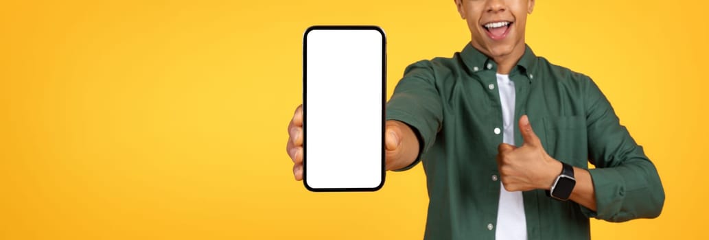 Cropped of black guy showing smartphone with white blank screen