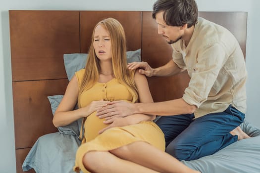 Expectant woman feels unwell, husband comforts and reassures her during a challenging pregnancy