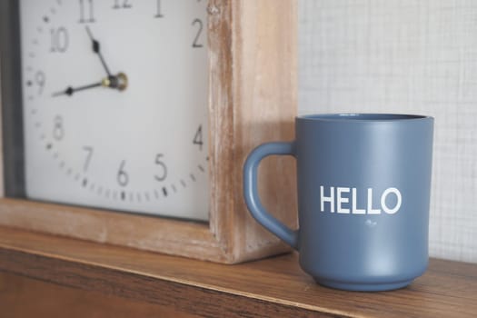 blue coffee cup with hello word