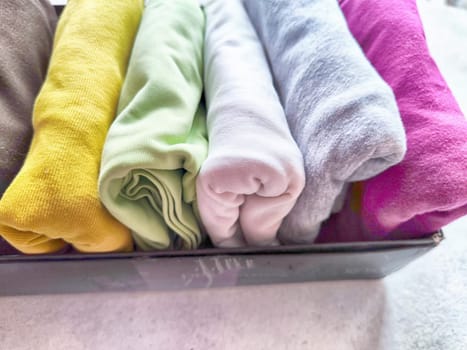 Tidy and organized clothes with the konmari method. Storage of T-shirts folded in a box