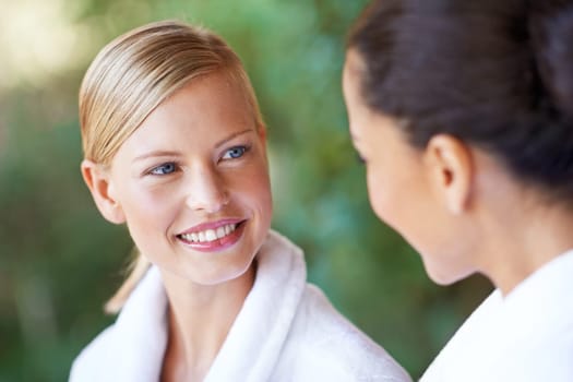 Women, friends and spa with morning, hotel and bathrobe from wellness and skincare treatment. Relax, happy and smile from bonding and people with hospitality at lodge with luxury care outdoor.