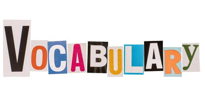 The word vocabulary made from cut out letters 