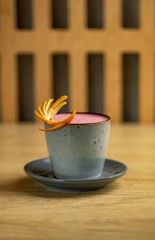 Strawberry latte with orange peel 