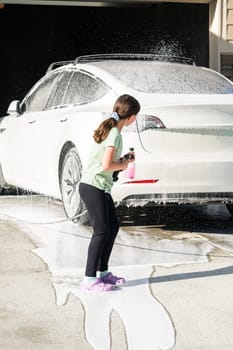 Little Helper Washing the Family Electric Car