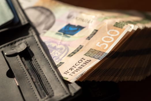 Mens wallet with 500 hryvnia banknotes