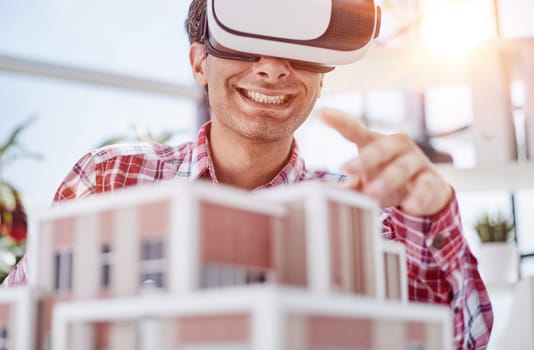 Virtual reality futuristic design technology. Architect or design engineer in VR headset for BIM technology
