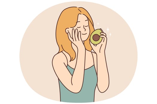 Smiling woman touch skin hold avocado in hands