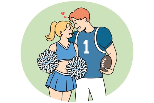 Smiling teen couple in sport uniform