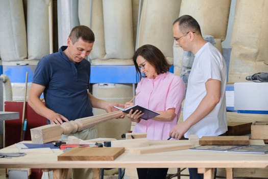 Group of working people discussing wood products