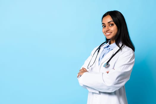 hindu doctor lady wearing medical white coat and stethoscope, studio