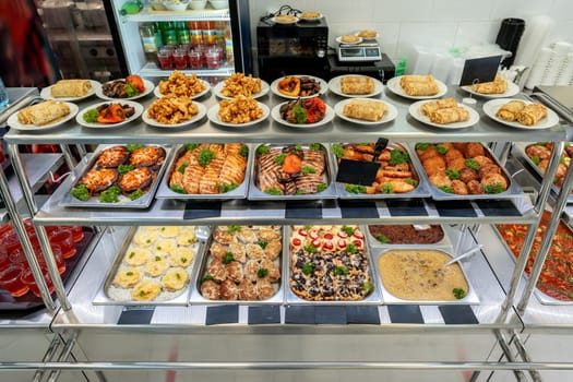 Display with fresh cooked food in a canteen close up