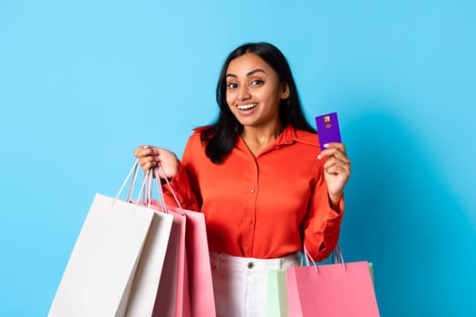 Happy Young Indian Woman Shopper Showing Credit Card, Studio Shot