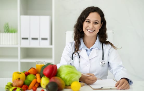 Portrait of positive lady dietitian looking at camera and smiling