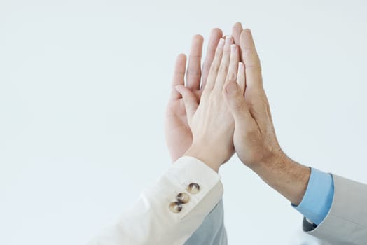 Hands, high five and people with celebration of success, achievement and support for teamwork. Business, collaboration and team building gesture for cooperation, solidarity and pride for winning