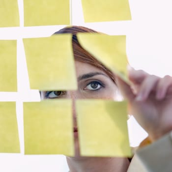 Employee, sticky notes and glass wall for thinking, planning and vision for logistics and ideas. businesswoman, brainstorming and management for meeting, goal and seo with decisions for marketing