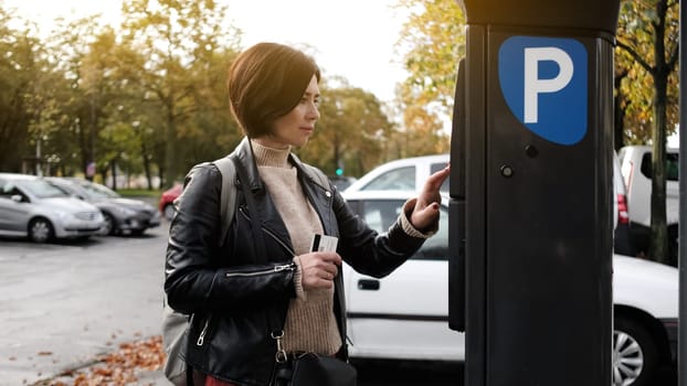 Woman Pays For Car Parking Via Parking Meter Using Credit Card