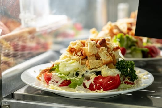 Showcase with salads in the dining room or cafeteria