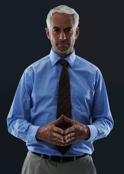 Senior, businessman and portrait or serious in studio with confidence and pride for corporate career or job. Mature, entrepreneur and ceo with face, thoughtful and contemplating on black background