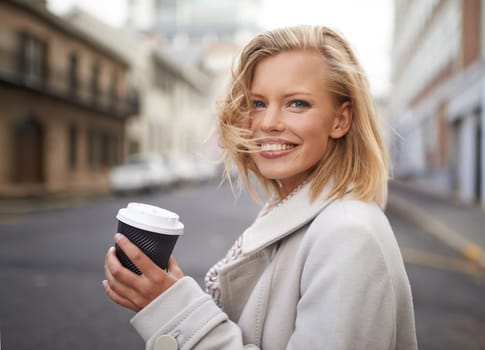 Happy, city and face of woman with coffee for commute, walking and journey in urban town. Travel, fashion and person with beverage, drink and cappuccino in trendy clothes, outfit and style in street.