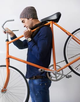 Man, studio and bicycle for sustainability, health and transportation on white background. Hipster cyclist, carbon neutral or eco friendly travel for environmental commute and fitness or exercise
