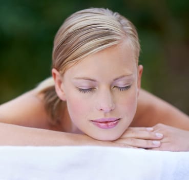 Woman, spa and sleeping after massage, facial or hotel beauty treatment with rest. Relax, calm and nap from cosmetics, care and hospitality from skincare and wellness zen with peace at a resort