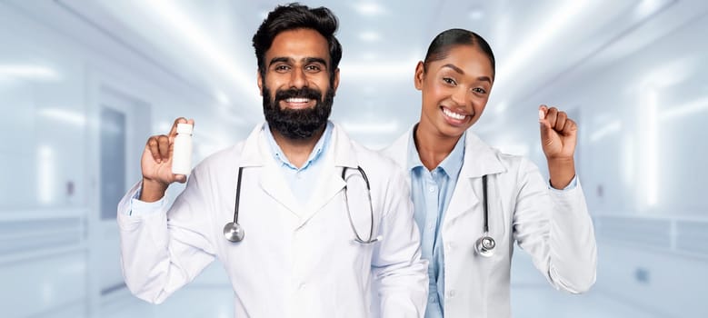 A male and a female medical professional are smiling confidently