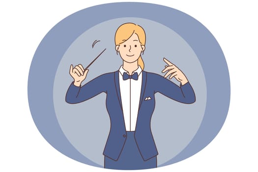 Female conductor with baton in hands