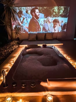 Night jacuzzi bathtub with movie projection in Doi Chang in Chiang Rai, Thailand