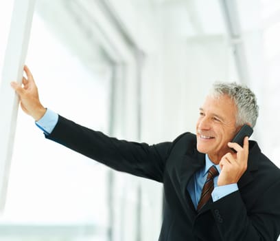 Phone call, smile and thinking with mature businessman in office for communication or networking. Future, planning and vision with happy professional manager in corporate workplace for conversation.